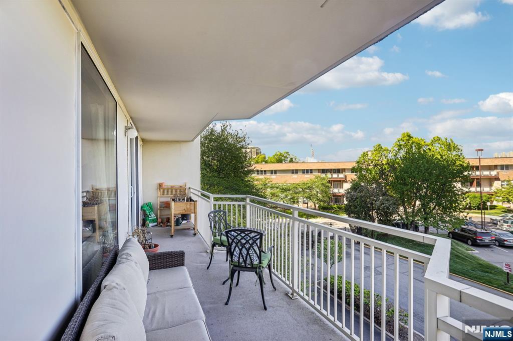 1077 River Road, Unit 303 Edgewater, NJ 07020 - Photo 26 of 27 a view of balcony with furniture