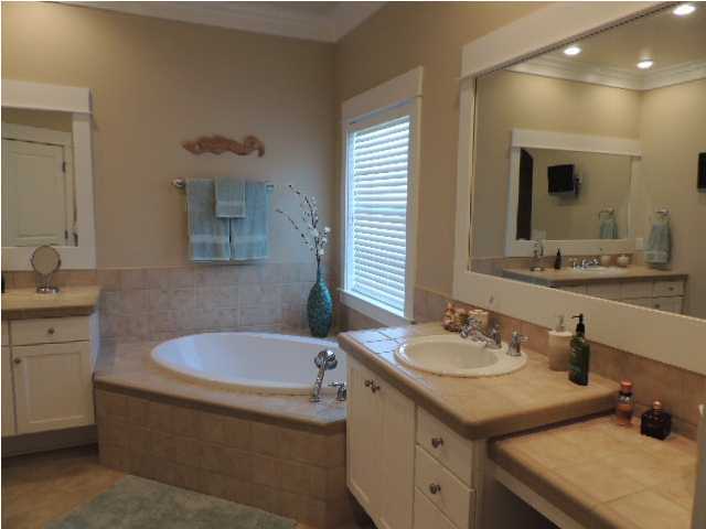 182 Preston Path Santa Rosa Beach, FL 32459 - Photo 16 of 32 a bathroom with a tub sink and mirror