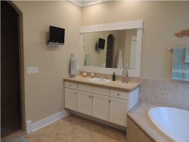 182 Preston Path Santa Rosa Beach, FL 32459 - Photo 17 of 32 a spacious bathroom with a granite countertop sink and a mirror