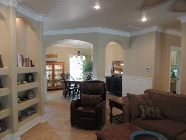 182 Preston Path Santa Rosa Beach, FL 32459 - Photo 19 of 32 a living room with furniture and a large window