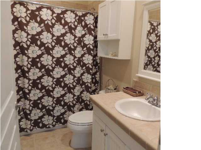 182 Preston Path Santa Rosa Beach, FL 32459 - Photo 26 of 32 a bathroom with a sink toilet and a mirror