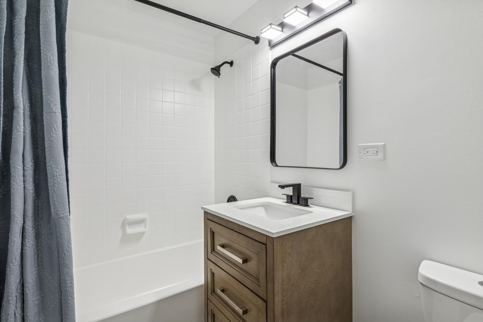 1240 Winfield Court, Unit 3 Roselle, IL 60172 - Photo 14 of 21 a bathroom with a sink and a mirror