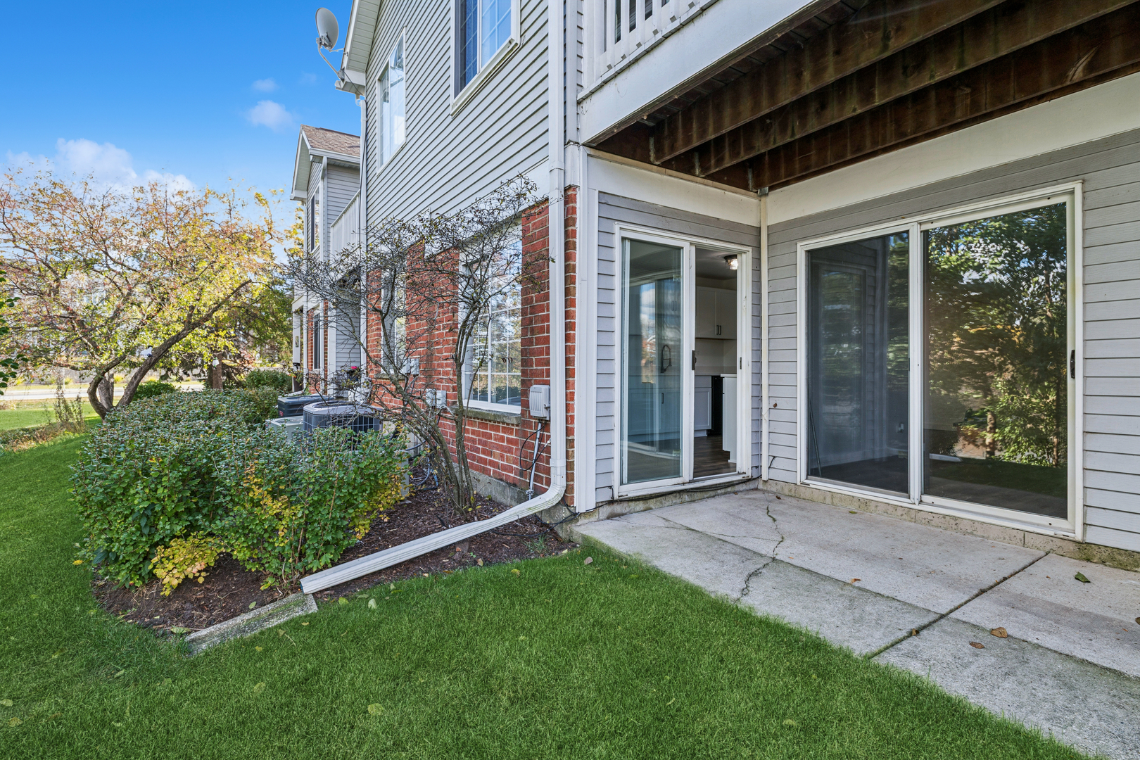 1240 Winfield Court, Unit 3 Roselle, IL 60172 - Photo 17 of 21 a view of a backyard with plants