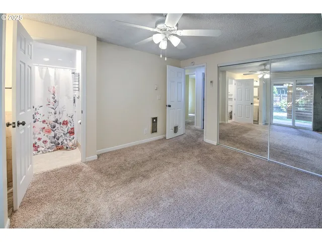 a bathroom with a toilet and a shower curtain