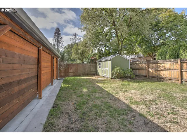 a backyard of a house with lots of green space
