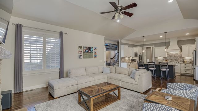 a kitchen with a sink stainless steel appliances and cabinets