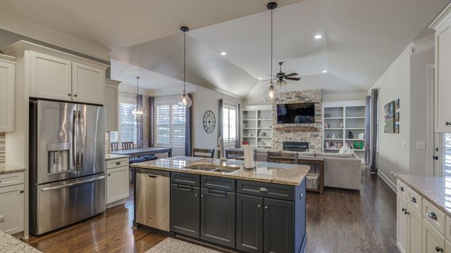 a view of a livingroom with furniture wooden floor front door and a rug
