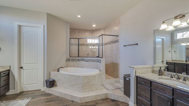 a view of a hallway with wooden floor and closet area