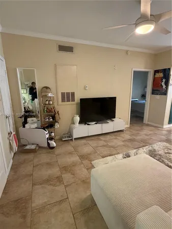 a living room with furniture a table and chairs
