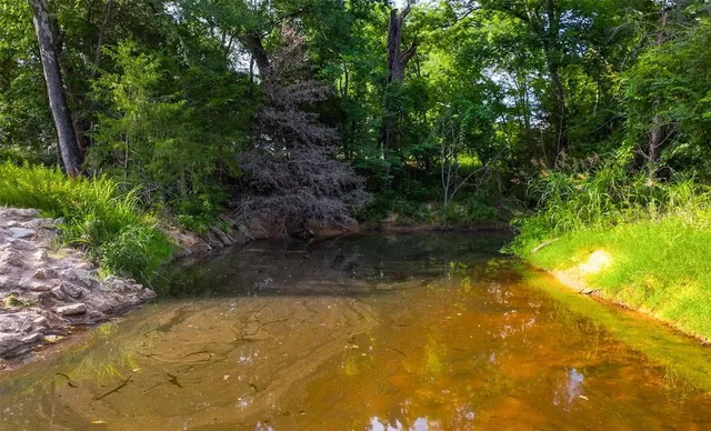 a view of a lake with a big yard