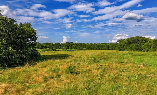 a view of lake with mountain in the background