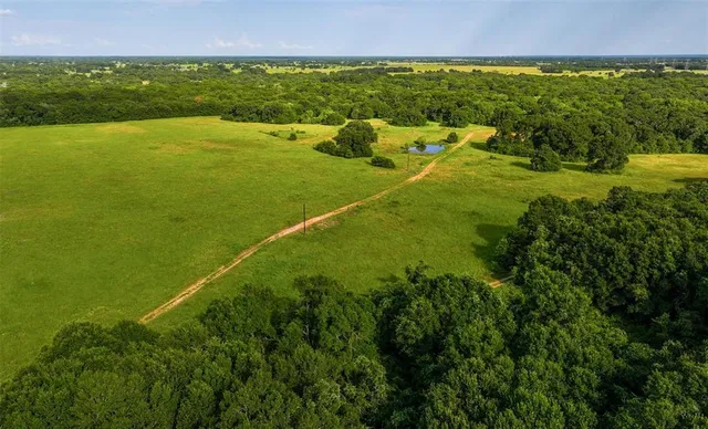 a view of an ocean and a yard