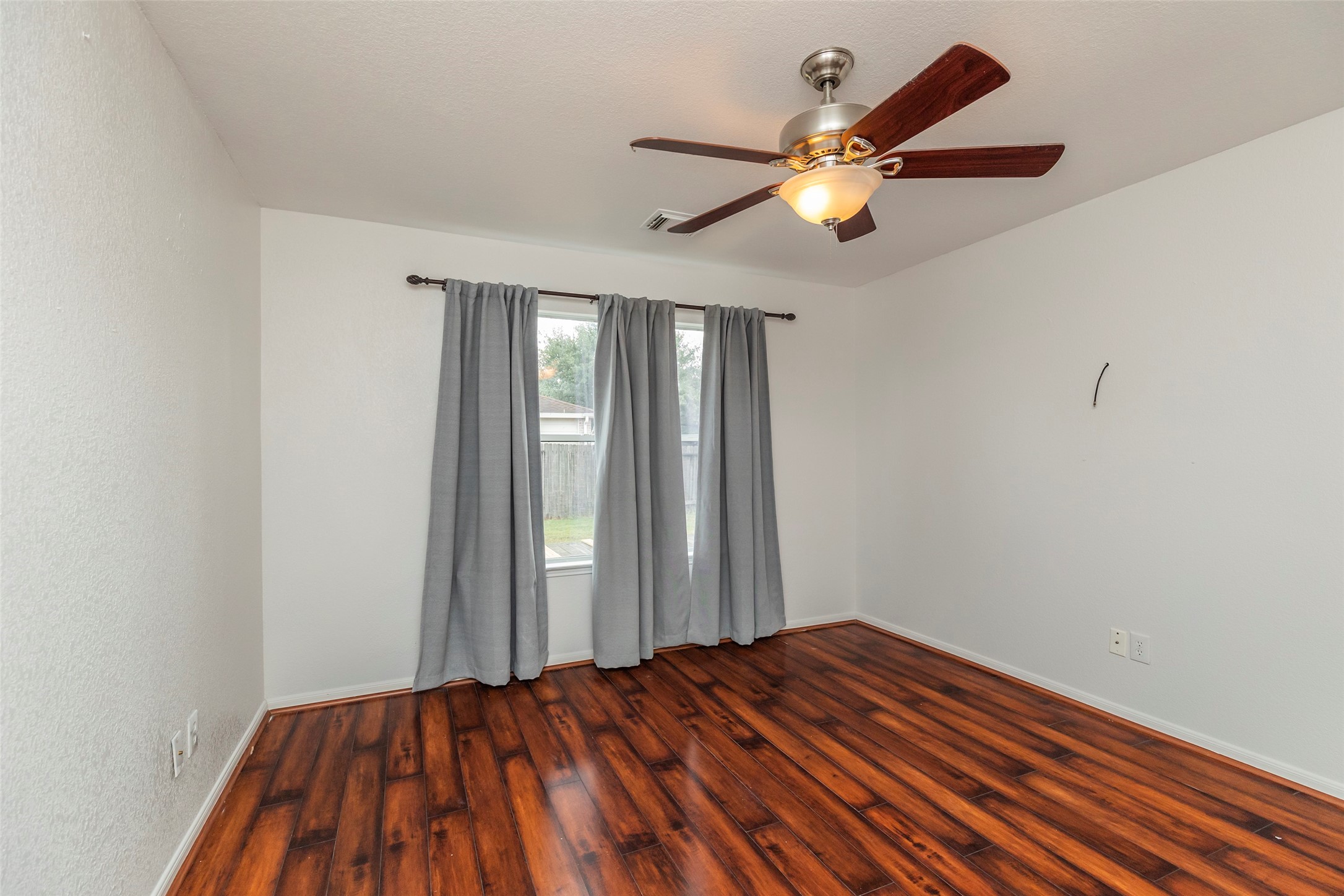 21202 Fire Wind Court Spring, TX 77379 - Photo 10 of 21 Primary Bedroom. Spacious and serene main bedroom perfect for rest and relaxation.