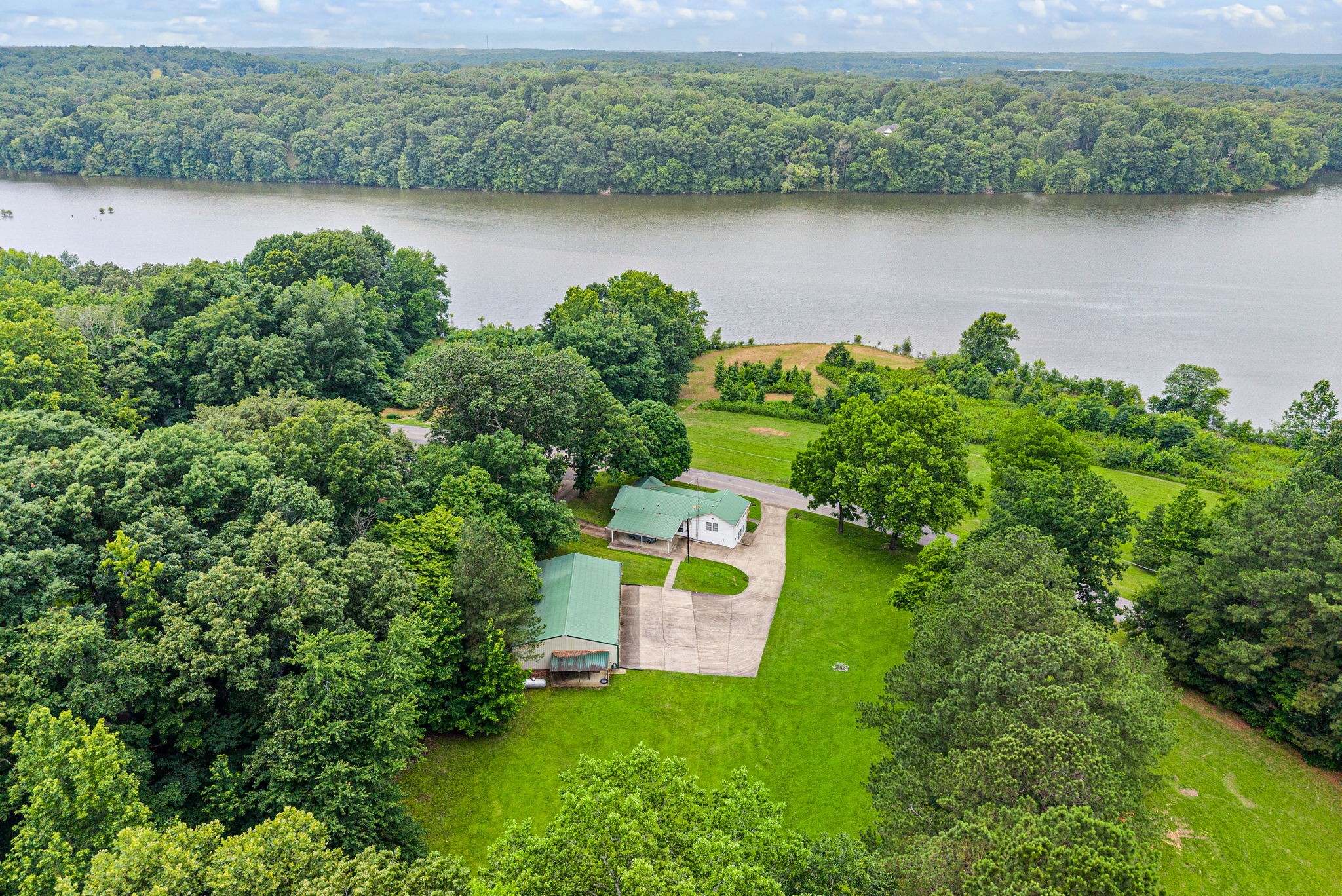196 Wildlife Road Dover, TN 37058 - Photo 1 of 98 an aerial view of a house with a yard and lake view