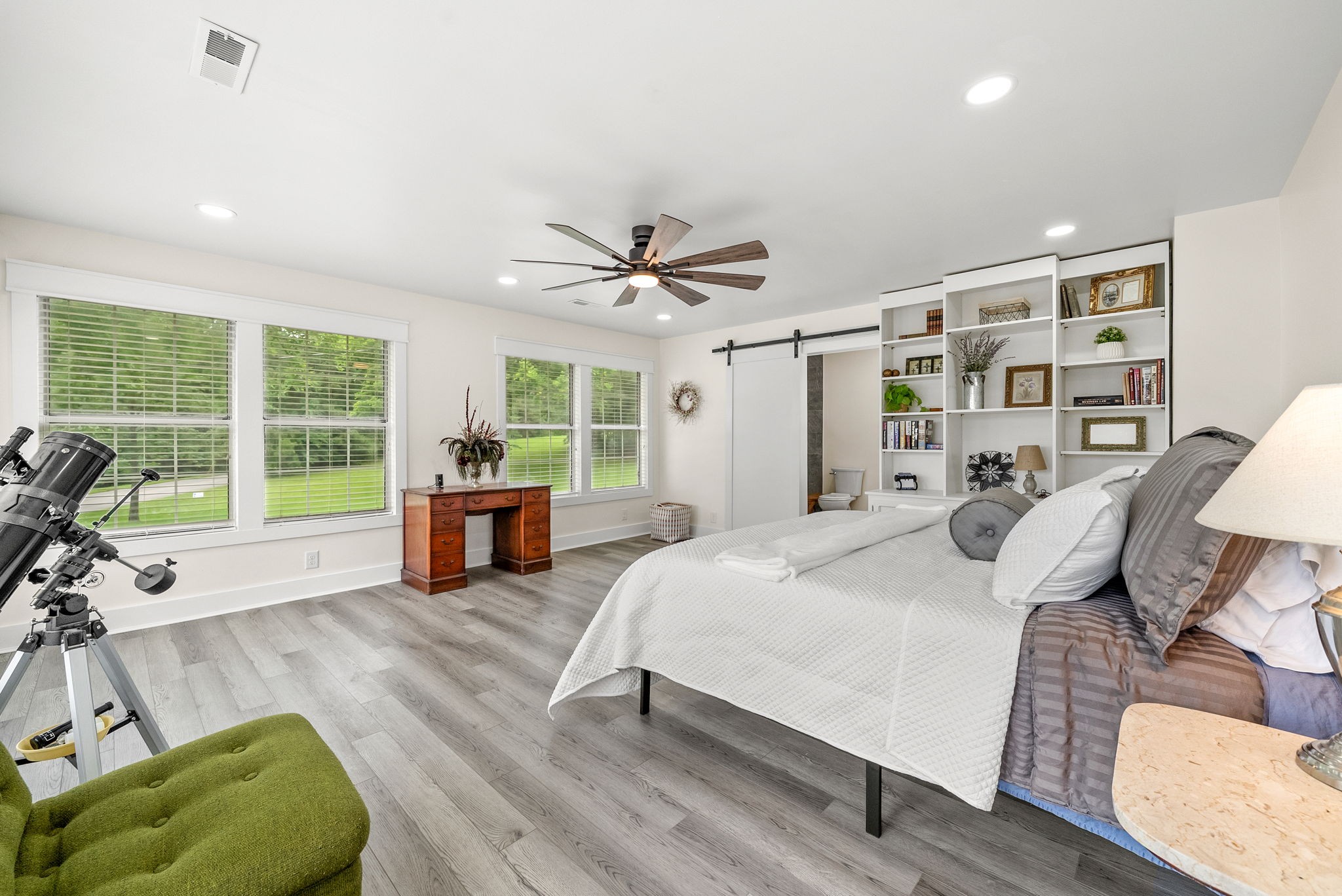 196 Wildlife Road Dover, TN 37058 - Photo 30 of 98 a large bedroom with a bed and glass walk in closet