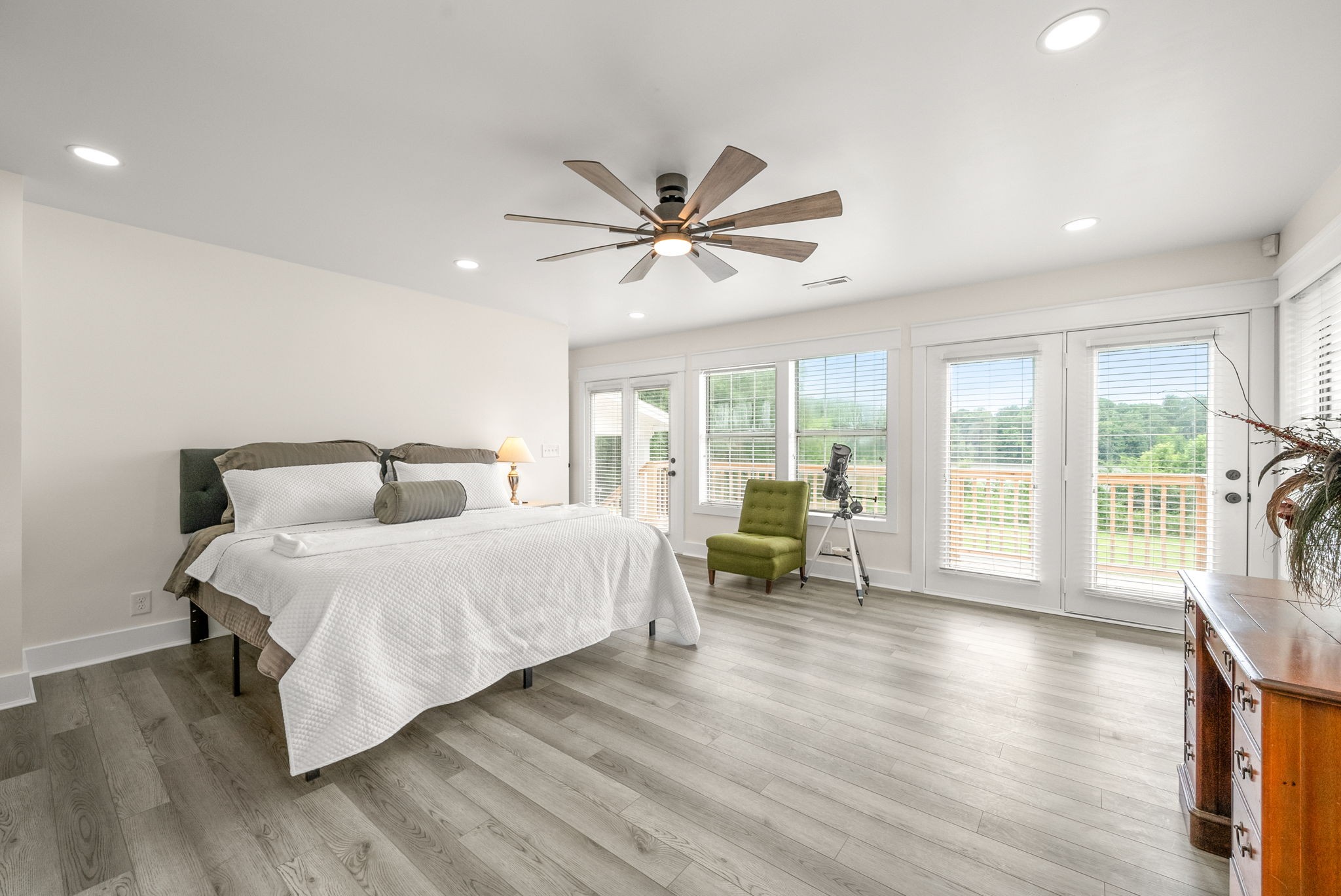 196 Wildlife Road Dover, TN 37058 - Photo 33 of 98 a spacious bedroom with a large bed and a large window