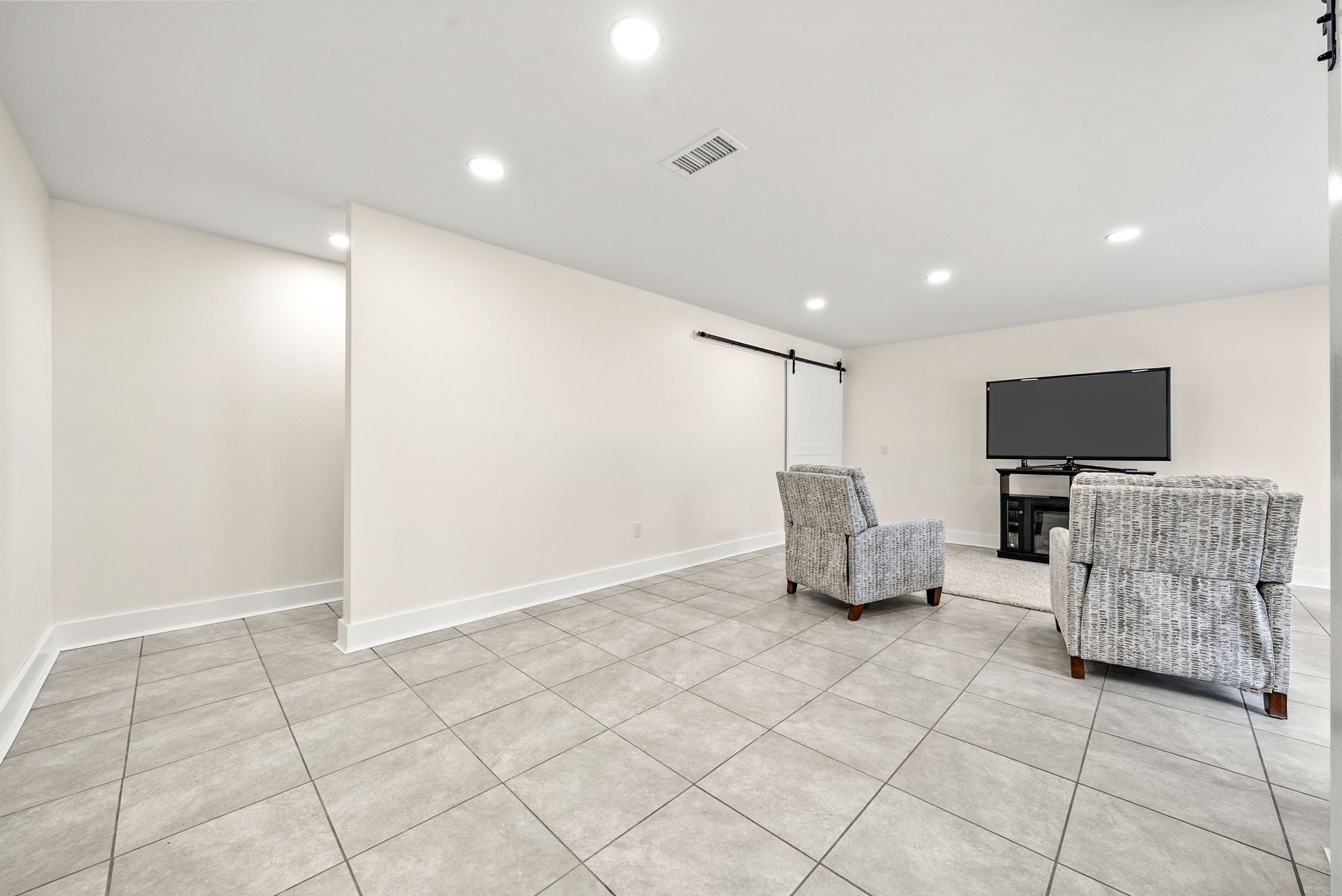 196 Wildlife Road Dover, TN 37058 - Photo 46 of 98 a room with furniture and flat screen tv