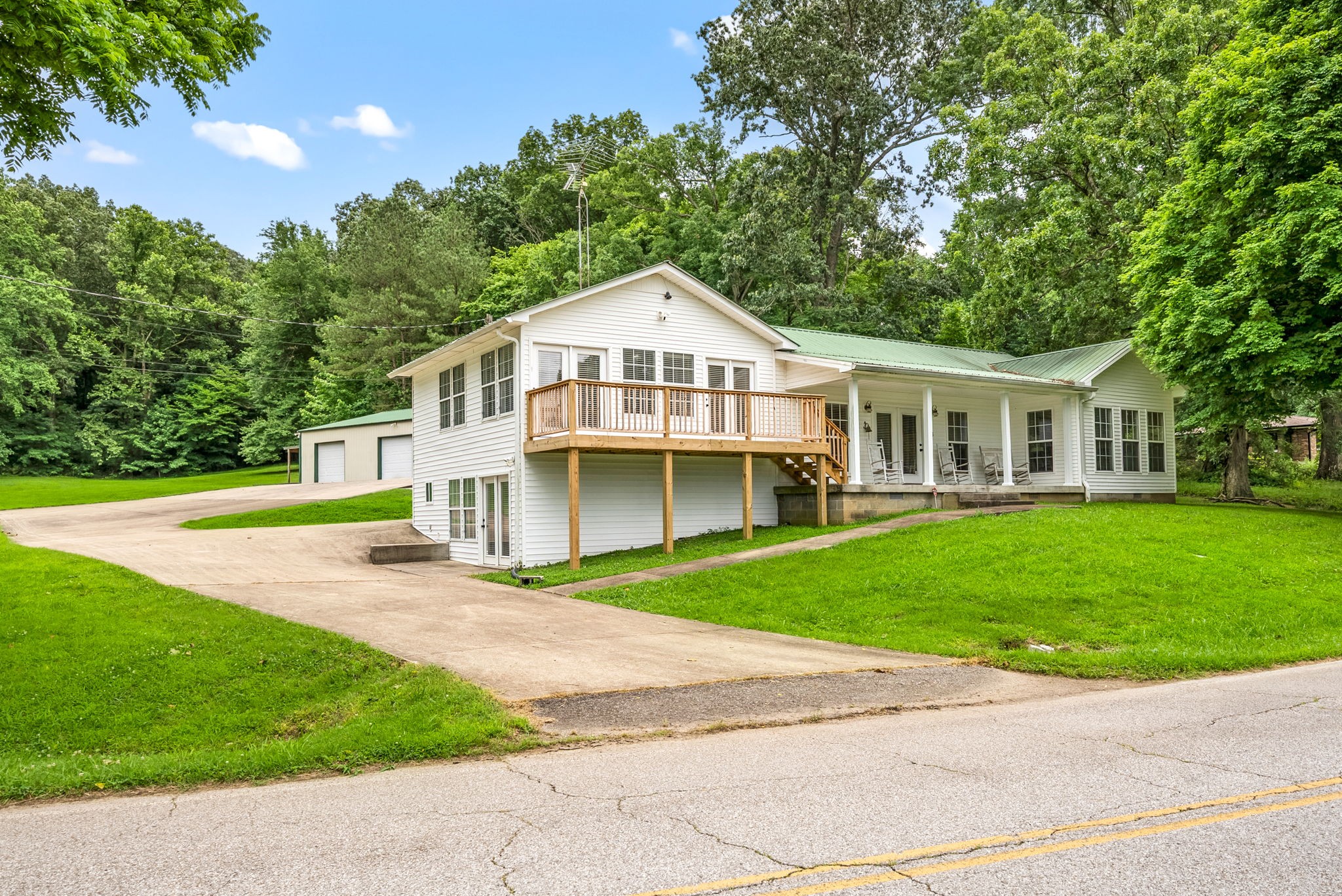 196 Wildlife Road Dover, TN 37058 - Photo 6 of 98 a front view of a house with a garden