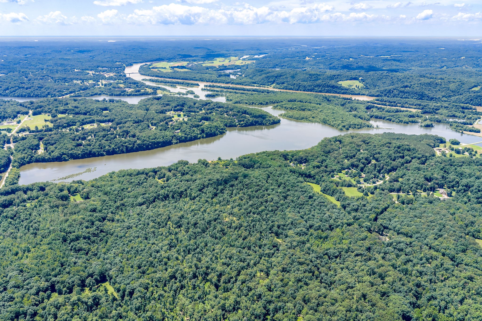 196 Wildlife Road Dover, TN 37058 - Photo 93 of 98 an aerial view of a city with lots of residential buildings and mountain view in back