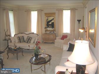 505 Northfield Road Devon, PA 19333 - Photo 2 of 6 a living room with furniture and a large window