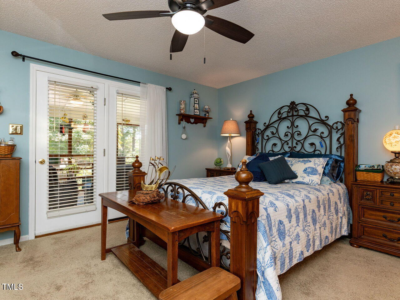 1025 Lake Path Road Willow Spring, NC 27592 - Photo 13 of 30 a bedroom with a bed and a chandelier