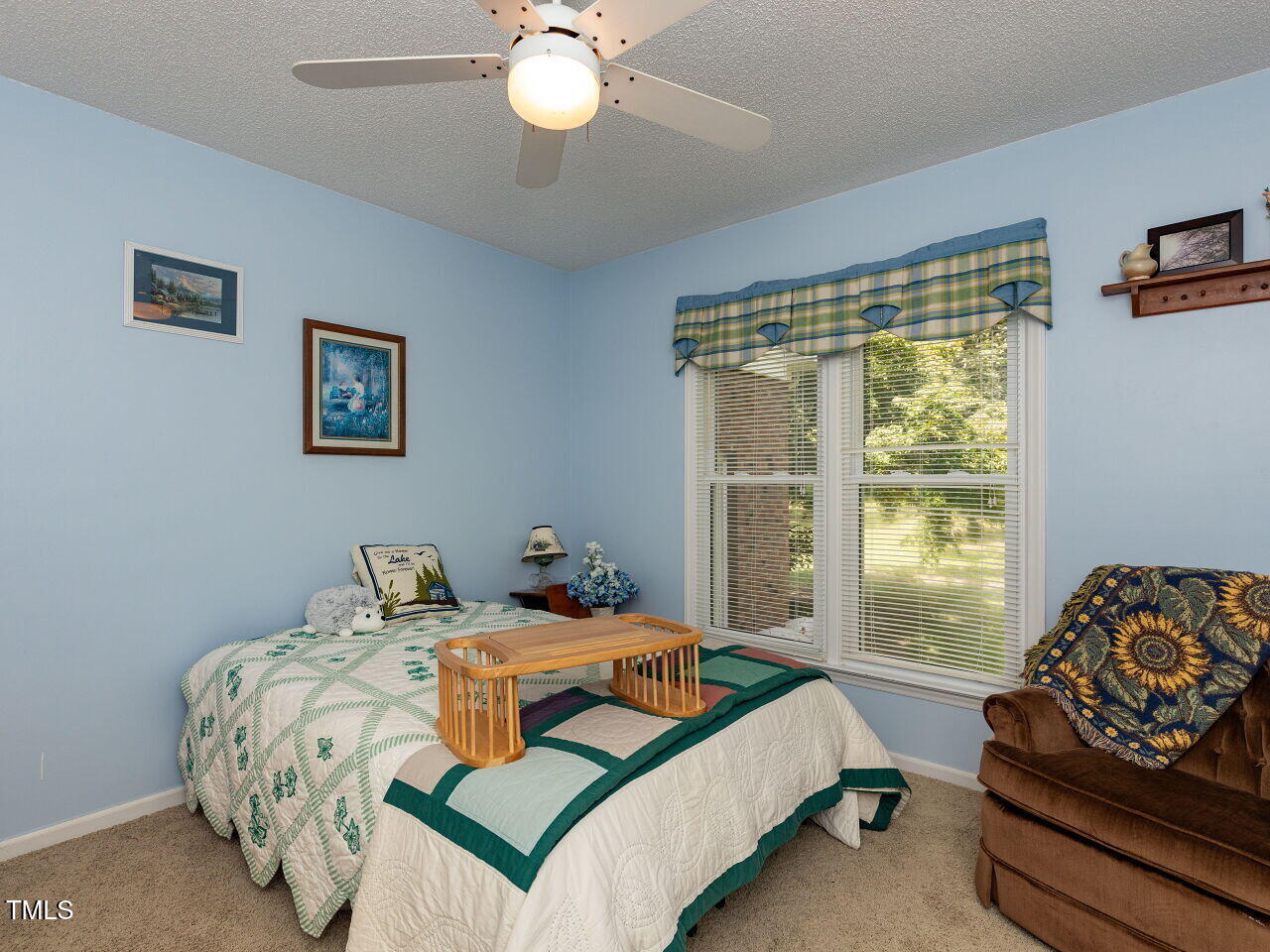 1025 Lake Path Road Willow Spring, NC 27592 - Photo 16 of 30 a bedroom with a bed and window