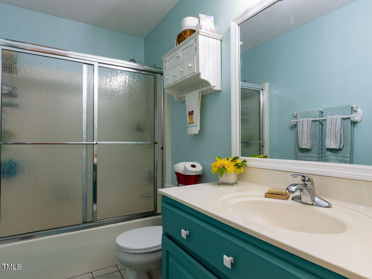1025 Lake Path Road Willow Spring, NC 27592 - Photo 17 of 30 a bathroom with a sink vanity granite and toilet