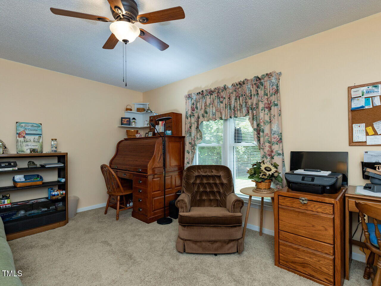 1025 Lake Path Road Willow Spring, NC 27592 - Photo 18 of 30 a living room with furniture and a flat screen tv