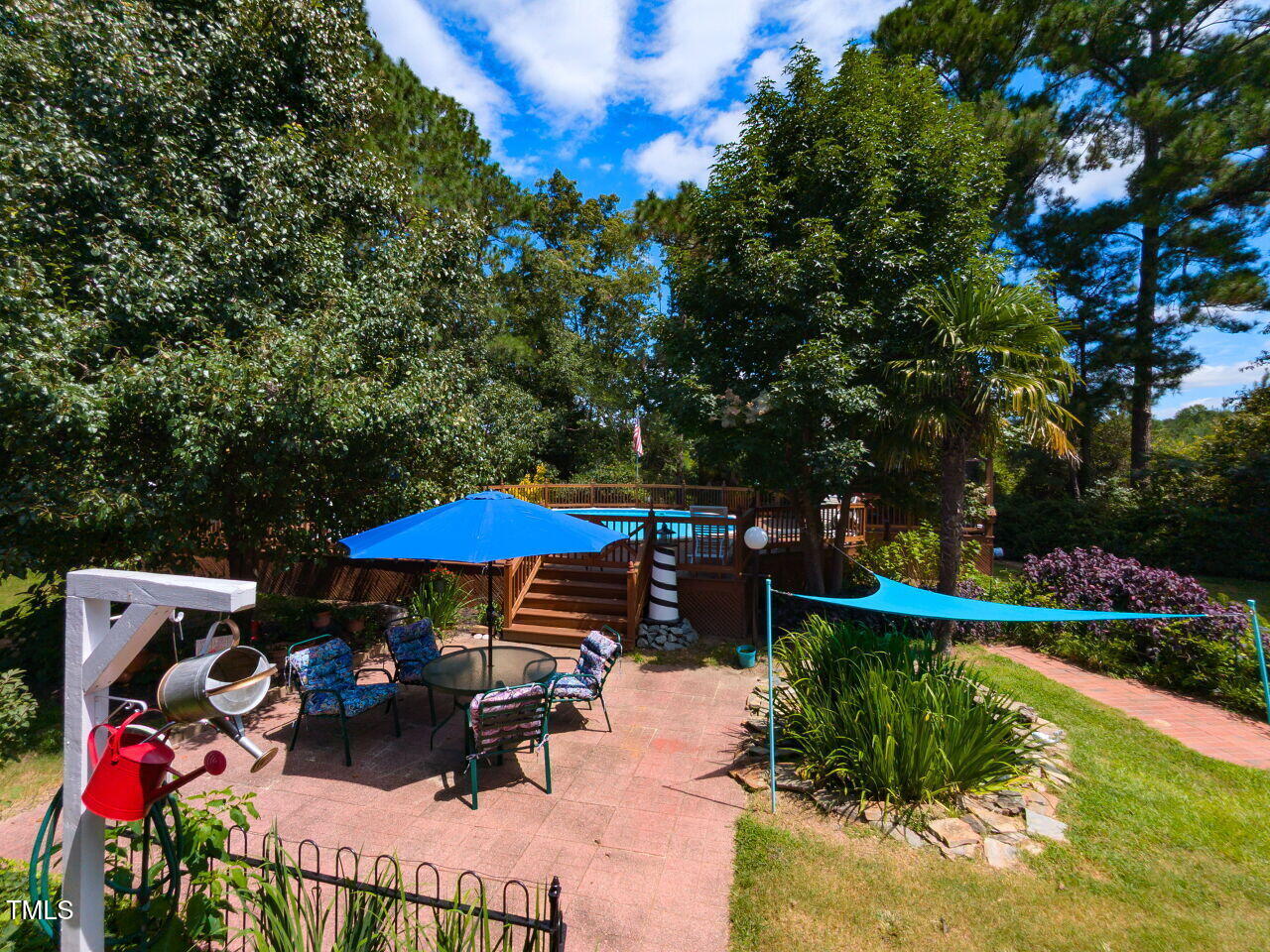 1025 Lake Path Road Willow Spring, NC 27592 - Photo 23 of 30 a view of a patio with furniture and a table