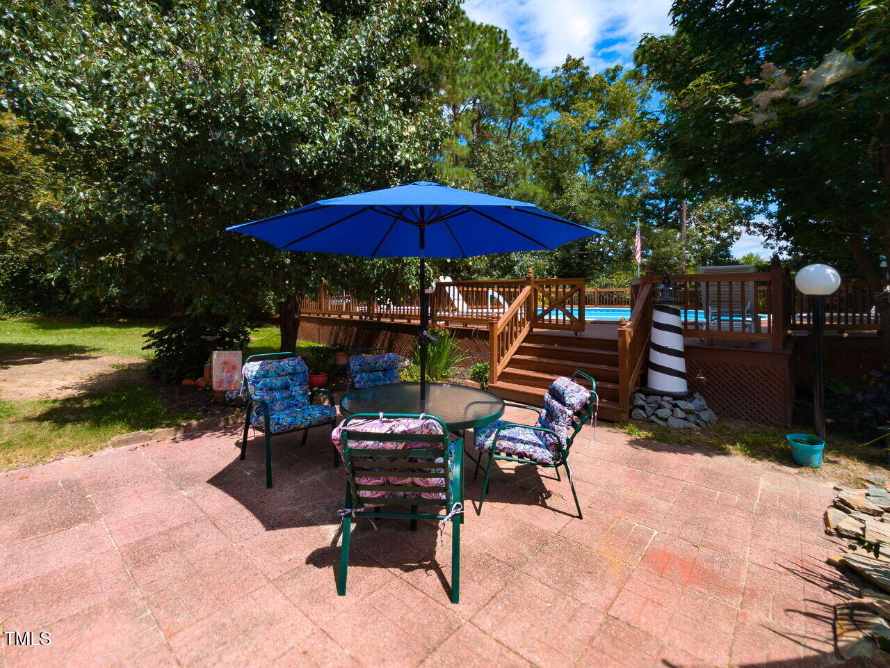 1025 Lake Path Road Willow Spring, NC 27592 - Photo 24 of 30 a view of backyard with outdoor seating and trees