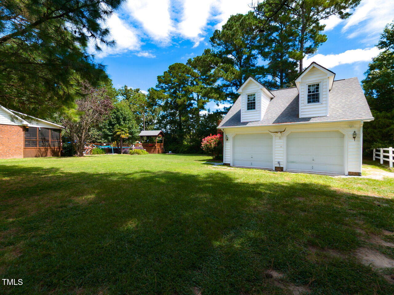1025 Lake Path Road Willow Spring, NC 27592 - Photo 28 of 30 a front view of house with yard and green space