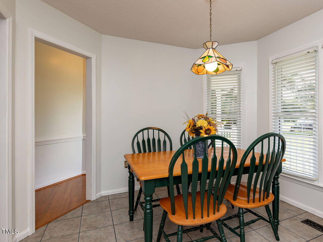 1025 Lake Path Road Willow Spring, NC 27592 - Photo 9 of 30 a view of a dining room with furniture window and wooden floor