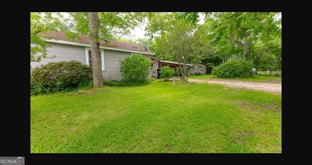 a view of backyard with green space
