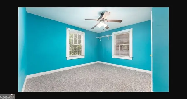 a view of an empty room with a window