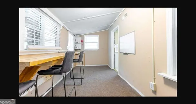a view of living room with furniture and window