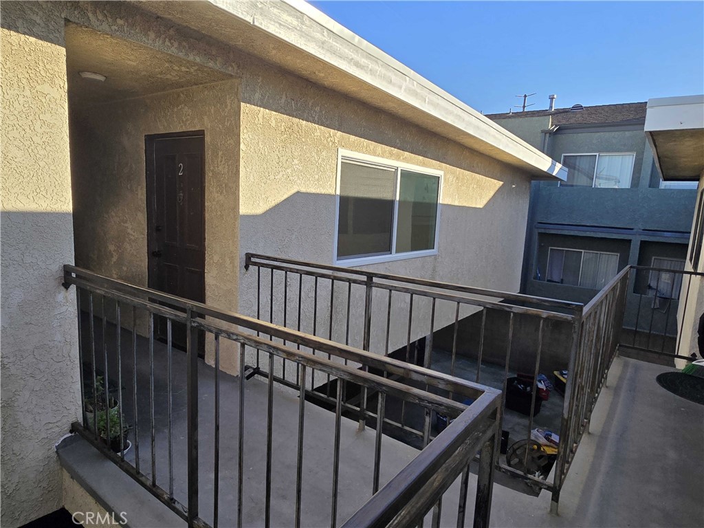 15917 Prairie Avenue, Unit 2 Lawndale, CA 90260 - Photo 9 of 10 a view of balcony with wooden floor and fence and a potted plant
