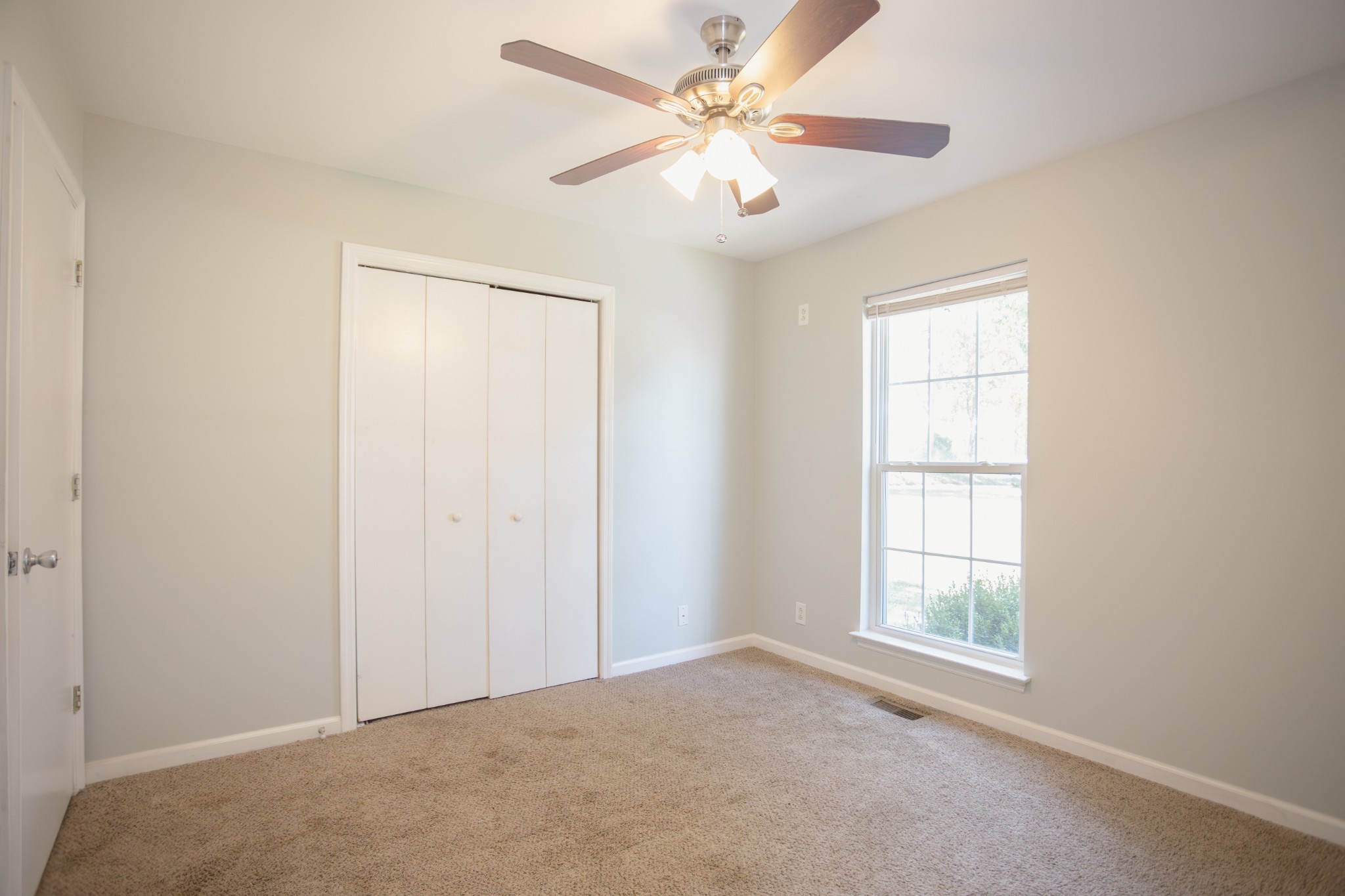 1052 Randy Road Ashland City, TN 37015 - Photo 16 of 30 an empty room with windows and fan