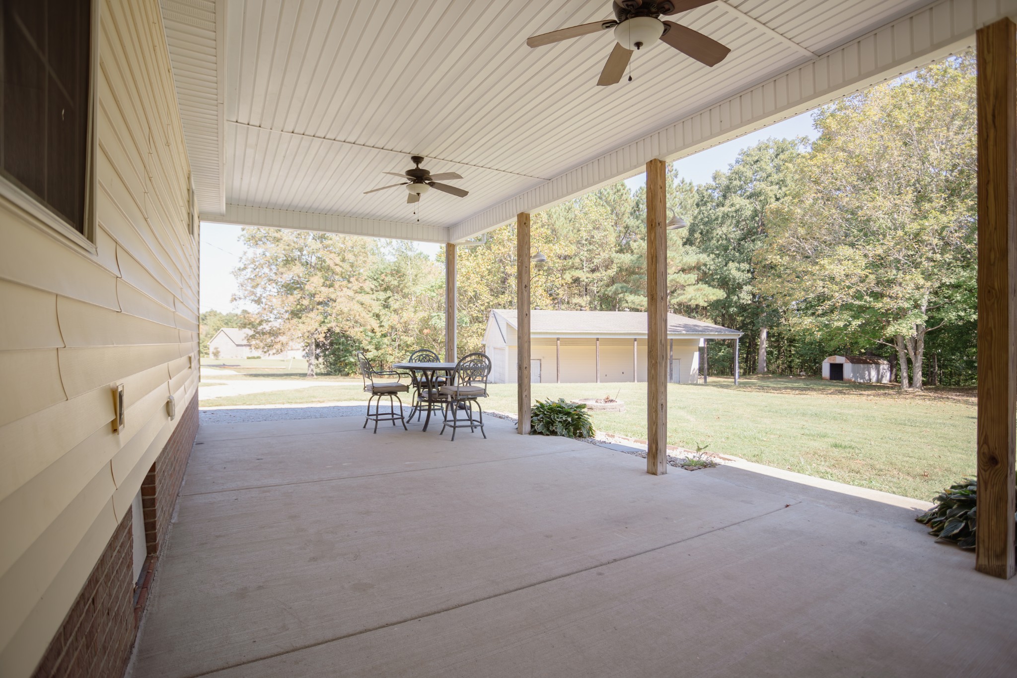 1052 Randy Road Ashland City, TN 37015 - Photo 21 of 30 a view of a porch with chairs and backyard