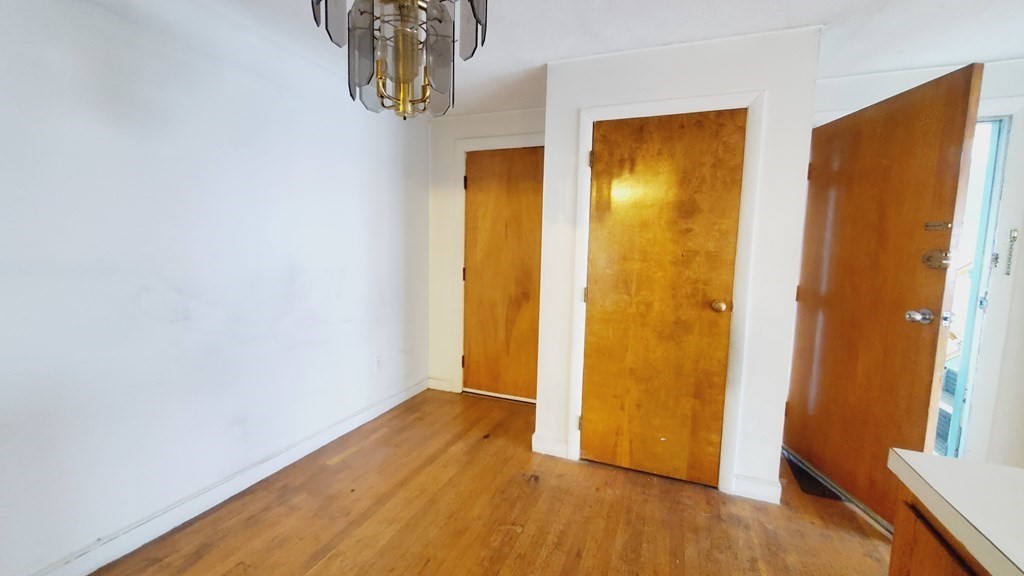 7 Commonwealth Court, Unit 5 Boston, MA 02135 - Photo 11 of 19 a view of front door with wooden floor