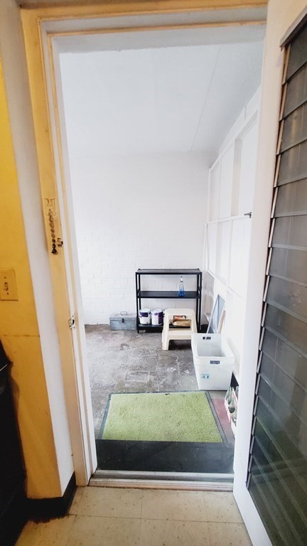 7 Commonwealth Court, Unit 5 Boston, MA 02135 - Photo 15 of 19 a living room with furniture and a rug