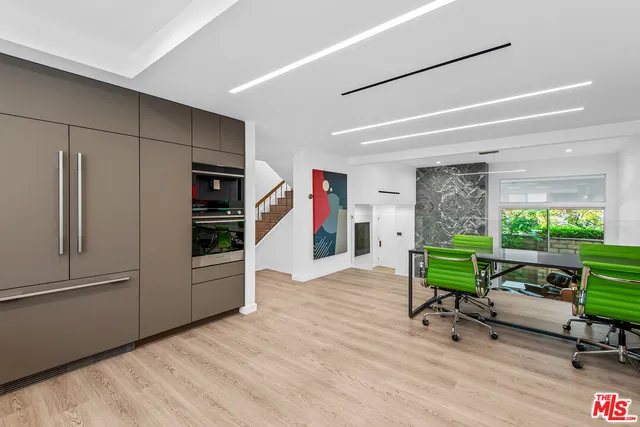 a view of a livingroom with furniture and a window