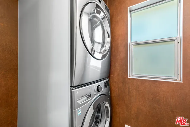 a view of a storage & utility room with washer and dryer