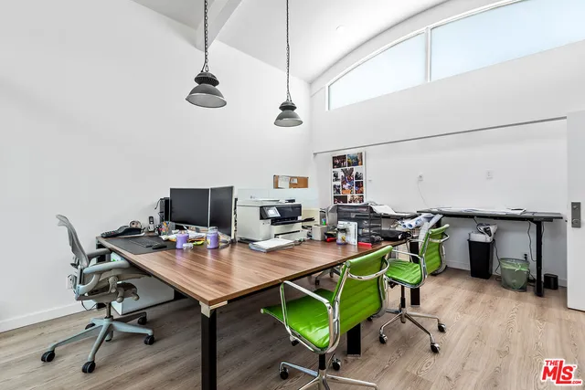 a view of a workspace with furniture
