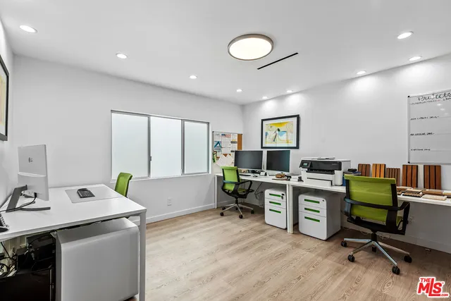 a workspace with furniture and wooden floor