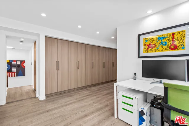 wooden floor in an empty room with a workspace