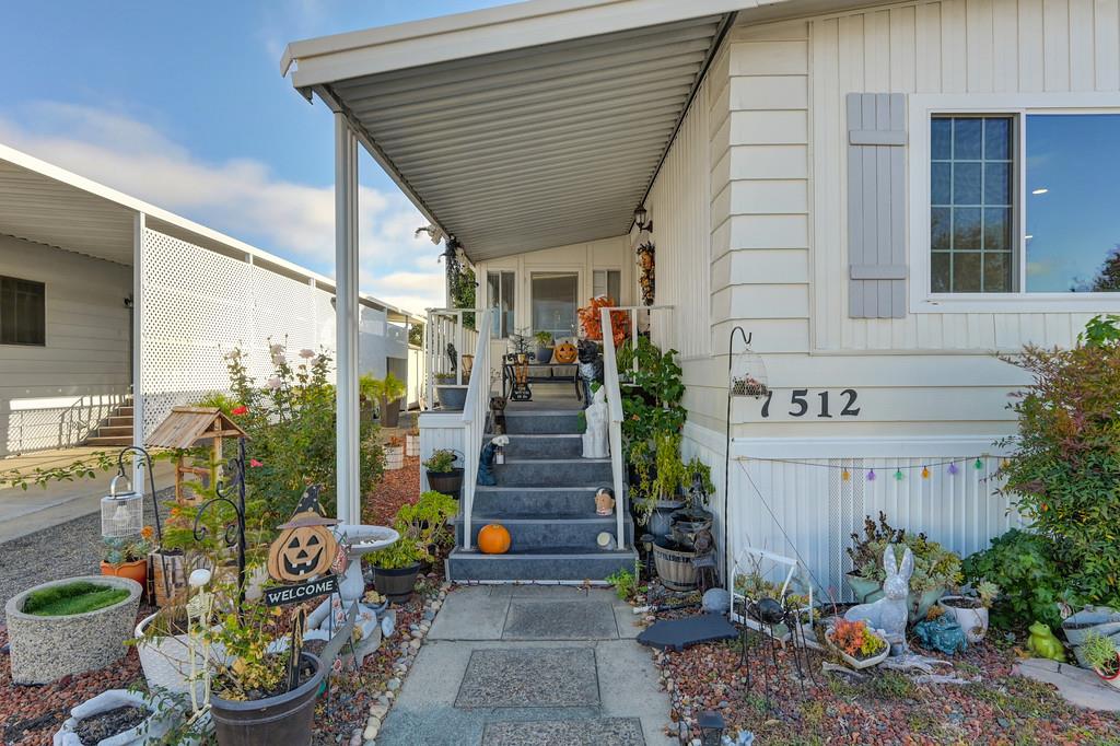 7512 Bufflehead Lane Citrus Heights, CA 95621 - Photo 11 of 52 a front view of a house with outdoor seating