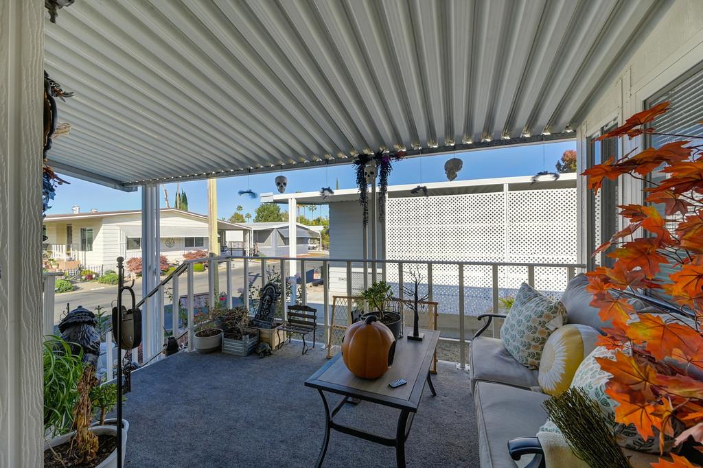 7512 Bufflehead Lane Citrus Heights, CA 95621 - Photo 14 of 52 a view of a porch with furniture and a backyard