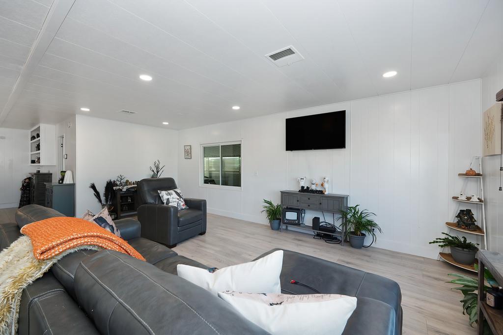 7512 Bufflehead Lane Citrus Heights, CA 95621 - Photo 21 of 52 a living room with furniture and a flat screen tv