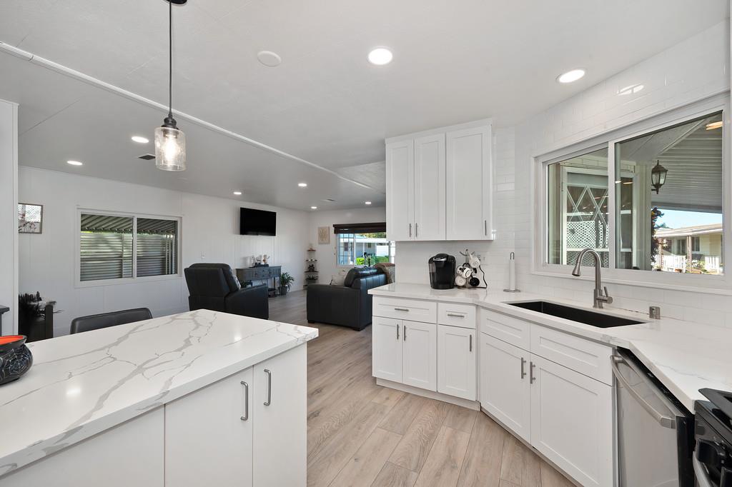 7512 Bufflehead Lane Citrus Heights, CA 95621 - Photo 23 of 52 a large kitchen with kitchen island a sink appliances and cabinets