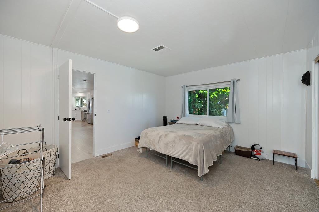 7512 Bufflehead Lane Citrus Heights, CA 95621 - Photo 33 of 52 a bed sitting in a room next to a window